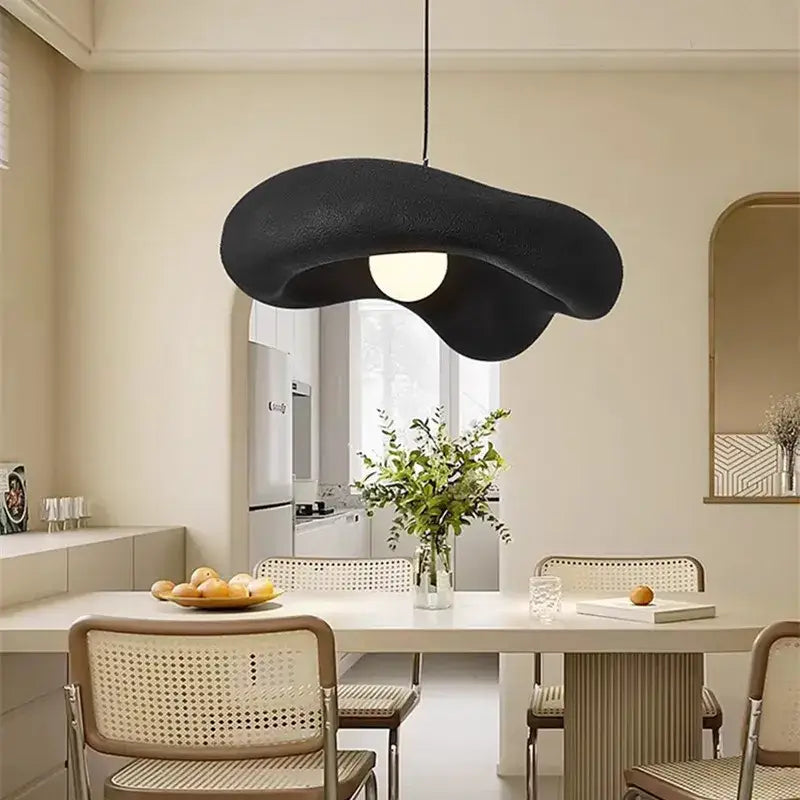 Black abstract pendant light with matte finish and organic shape from decorbites creamy style pendant collection for dining room