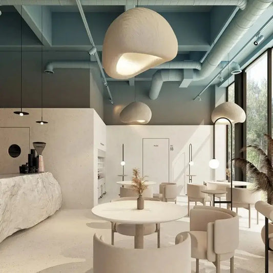 Cream-colored organic-shaped pendant light with soft matte finish for stairs and living room decorbites creamy style wabi