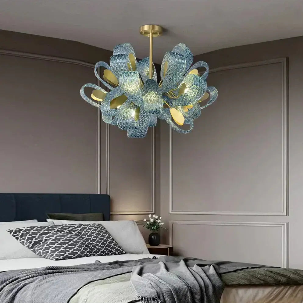 Creative blue glass luxury pendant light with gold accents and modern sculptural design for bedroom decorbites decor