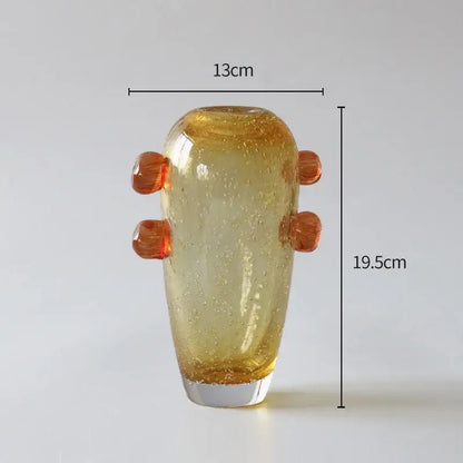A translucent amber bubble glass vase with textured surface and four rounded orange handles for creative bubble glass decorbites creative bubble living room decor
