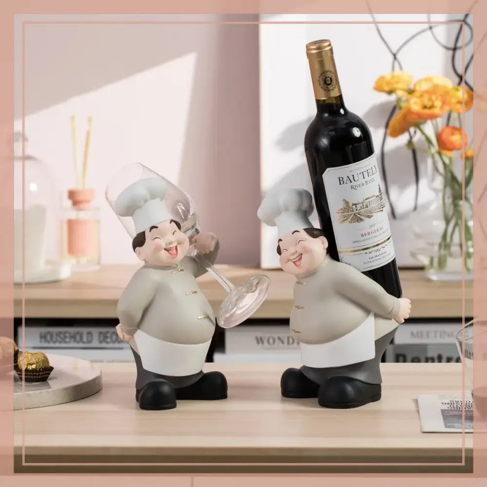 Two smiling chef figurines hold bautel river red wine in creative chef wine rack sculpture kitchen decor