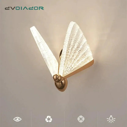 Gold-toned creative colorful butterfly led wall lamp with translucent textured woven glass wings emitting soft glow