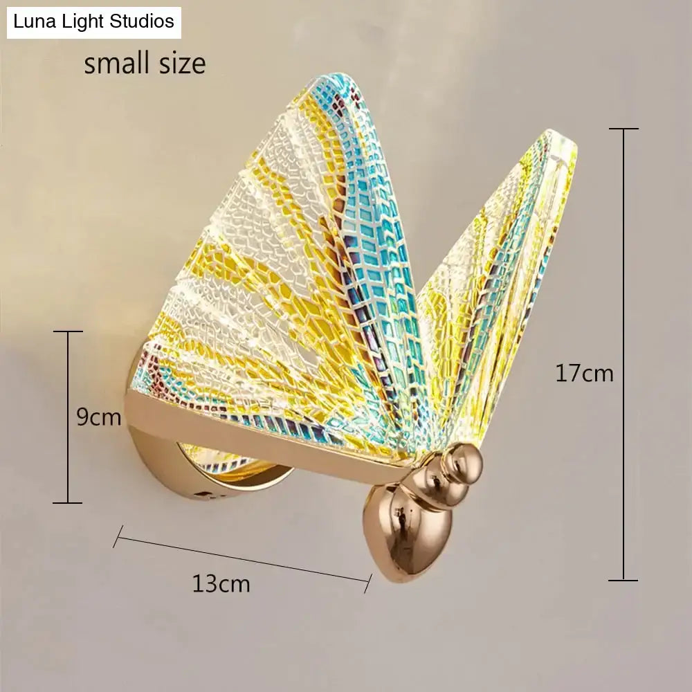 Creative colorful butterfly led wall lamp with mosaic blue yellow white wings and gold-toned body for bedroom decor