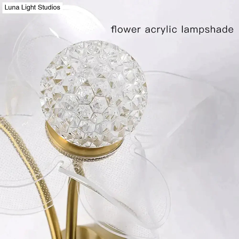Creative floral decorative gold led wall lamp with clear faceted acrylic lampshade and gold-toned metallic base