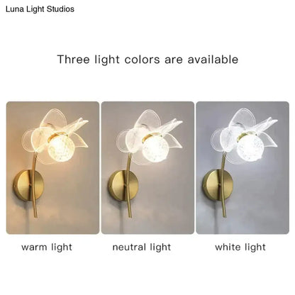 Creative floral decorative translucent flower-shaped wall sconce with brass-finished stem and decorative gold led light