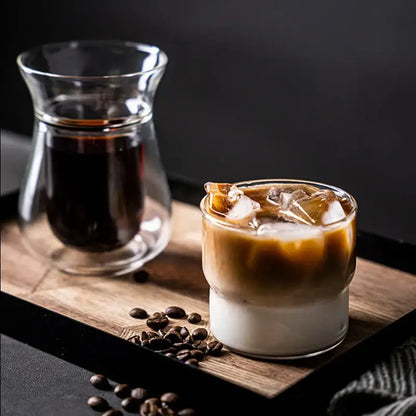 A clear glass coffee smoothie cup with layered iced espresso and milk heat resistant decorbites creative drinkware