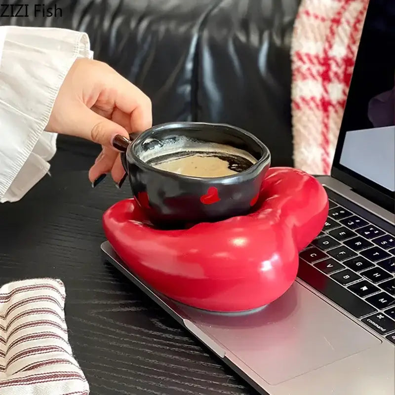 Black ceramic creative heart porcelain coffee mug with red heart decals on glossy red lip-shaped coaster decorbites creative heart