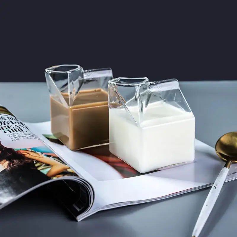 Two clear glass cup milk box containers with white and brown liquids from decorbites creative milk set of 2