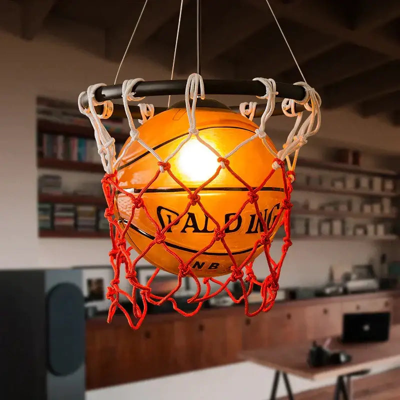 Creative orange basketball pendant light featuring a glowing spalding basketball in a red and white net hoop decorbites basketball pendant