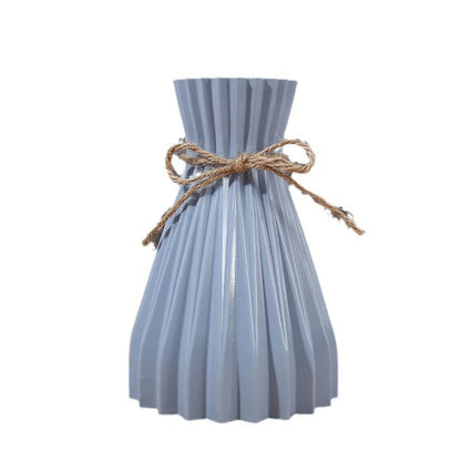 Light blue pleated ceramic flower bottle type adorned with rustic twine bow for dry flower bottle use