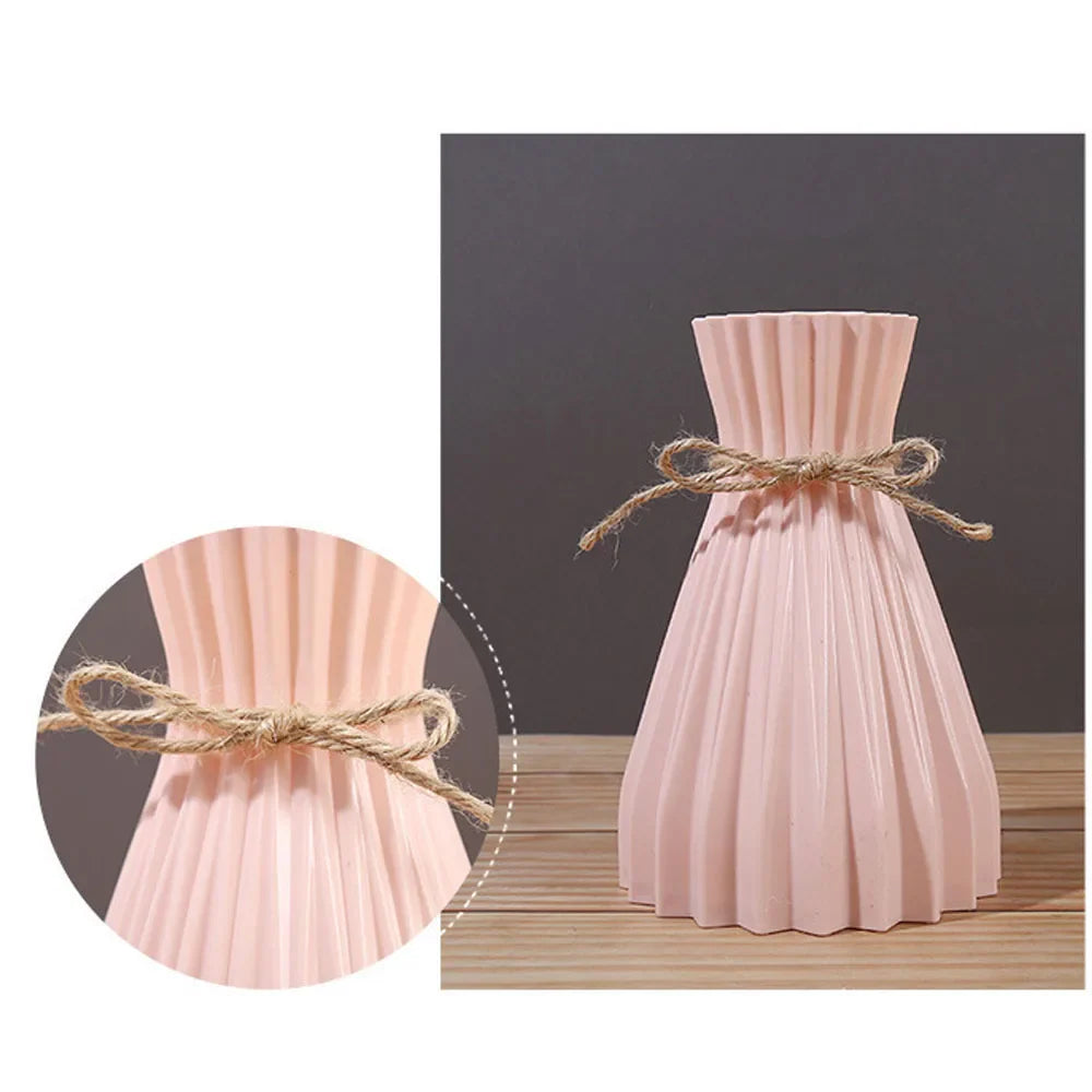 A blush pink pleated ceramic flower bottle type with rustic twine bow ideal as a modern dry flower bottle