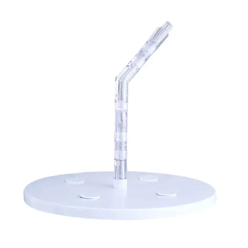 Clear plastic cake stand support with curved segmented arm on white circular base for kitchen baking use
