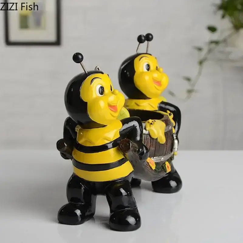 Creative yellow and black bee resin vase featuring glossy bee resin figurines with one holding a miniature wooden barrel