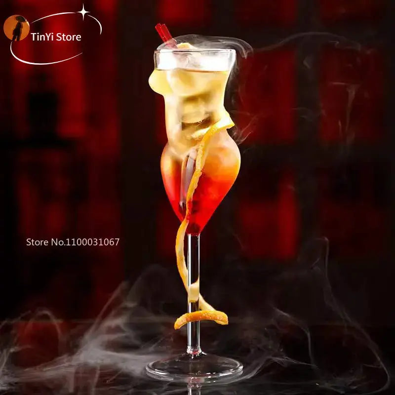 Crystal beauty goblet slender cocktail glass with layered red and yellow drink and orange peel twist decorbites crystal beauty
