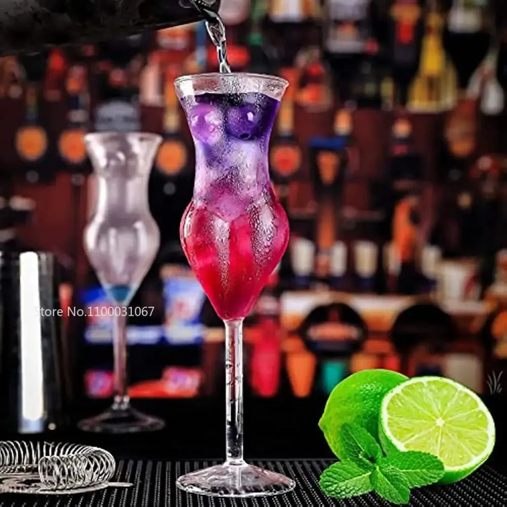 A decorbites crystal beauty goblet cup featuring a vibrant gradient cocktail with ice and lime slices in an elegant slender glass