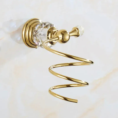 Gold-toned spiral towel rack with crystal accents and polished brass finish in crystal bathroom accessories set by decorbites brass