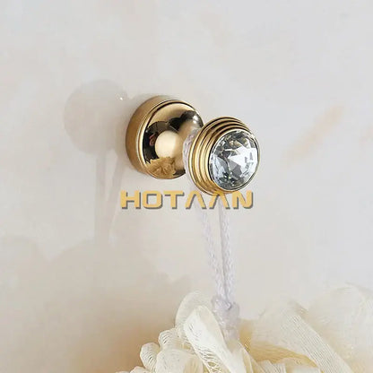 Gold-toned wall hook with faceted crystal accent and ribbed design from decorbites crystal chrome wall hook set
