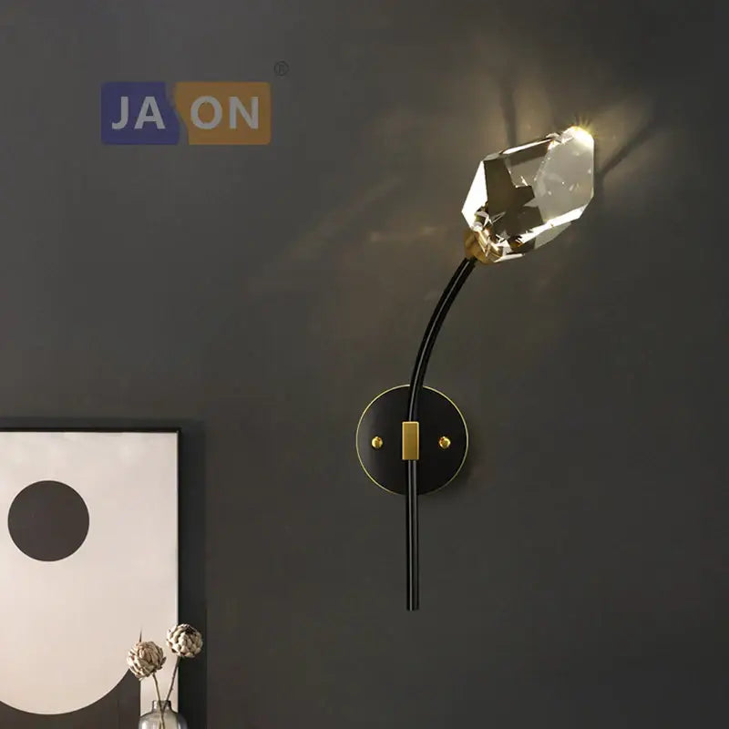 A sleek black and gold wall sconce with faceted crystal lamp head for decorbites crystal copper chandelier lighting