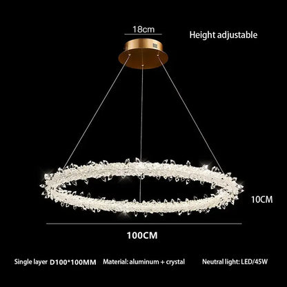 A modern crystal flower led ring chandelier with gold-toned mount and clear crystals for dining room lighting