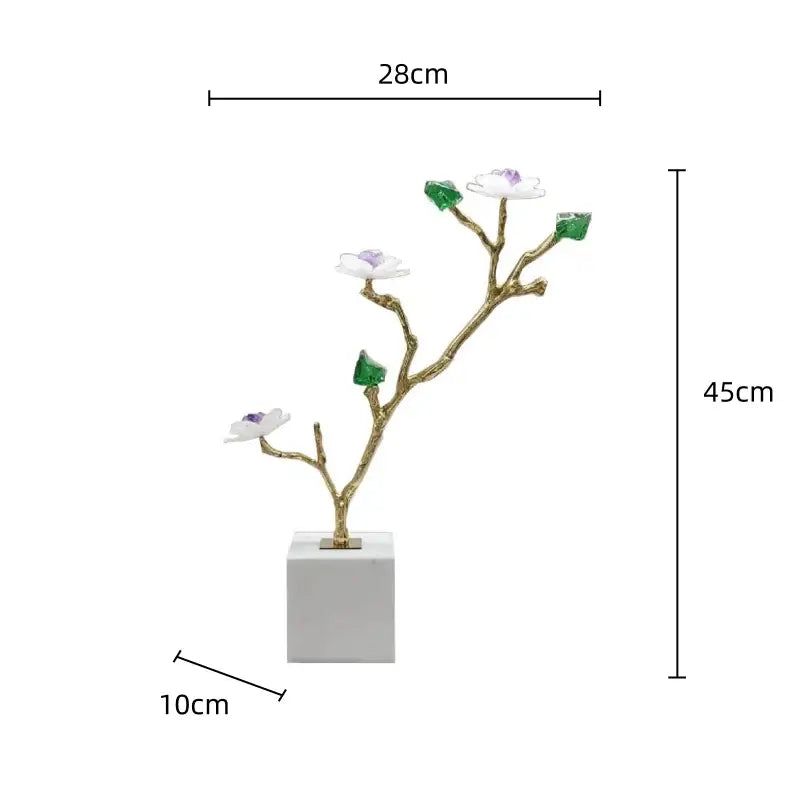 Elegant gold-toned crystal flower tree sculpture with white blossoms and green gemstone leaves on white marble base decorbites decor