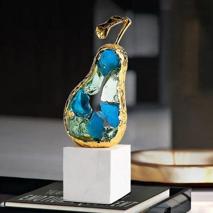 Decorbites crystal fruit gold-toned glass pear sculpture with blue and green inlays on white marble base for living room decor