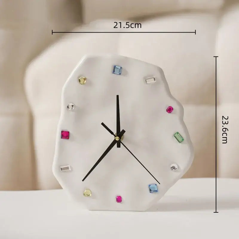 A white ceramic crystal geometric wall clock with colorful gemstone markers and black hands for living room decorbites decor