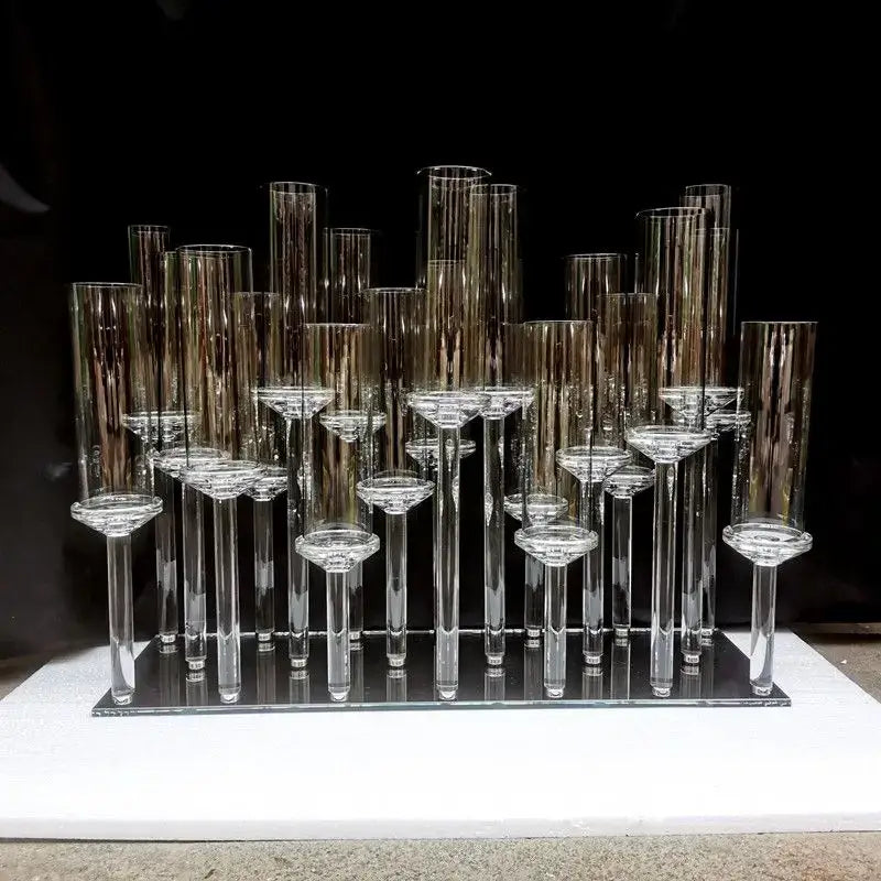 Crystal glass candle holders with teardrop accents and slender stems in a modern geometric dining room display decorbites crystal glass