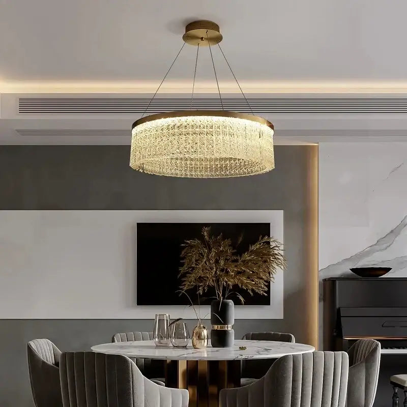 Gold-toned circular decorbites crystal glass gold pendant chandelier with cascading crystals for dining room lighting