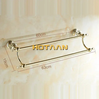 Gold-colored double towel bar with crystal embellishments on bars and ends for elegant bathroom use
