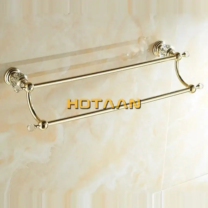 Gold-toned double towel bar with crystal accents and polished metal finish for bathroom use