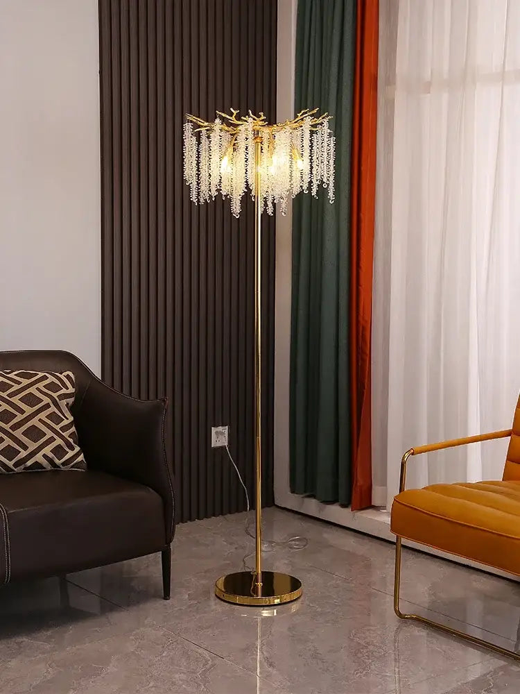 Gold-toned floor lamp with branching design and cascading decorbites crystal gold beads for living room decor