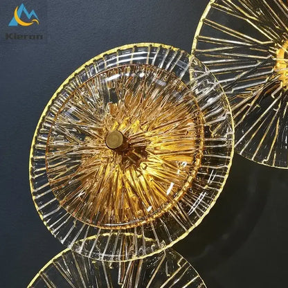 Golden glass shades with intricate radial patterns and metallic rim on decorbites crystal led wall lamps for living room decor