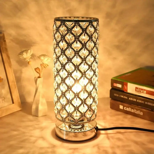 A crystal touch bedside lamp with a sparkling lattice design featuring clear crystals in a polished chrome frame