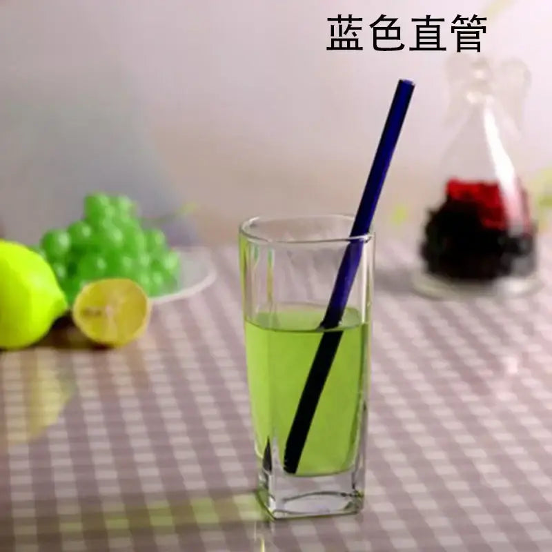 Blue straight glass drinking straw shown with curved amber glass drinking straw kitchen accessory