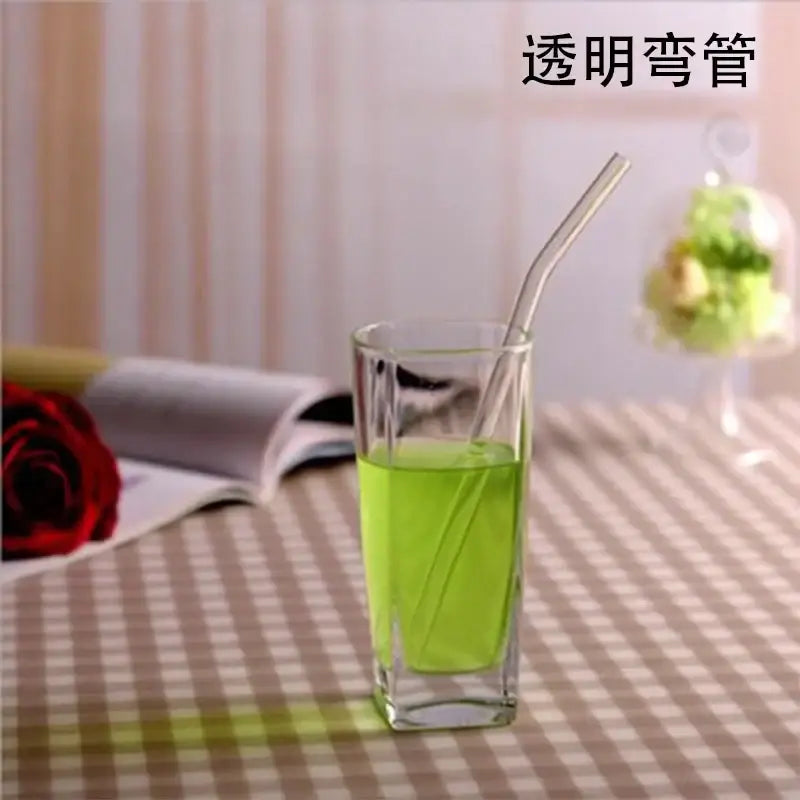 Transparent curved glass drinking straw designed as a kitchen accessory for glass drinking and beverage use