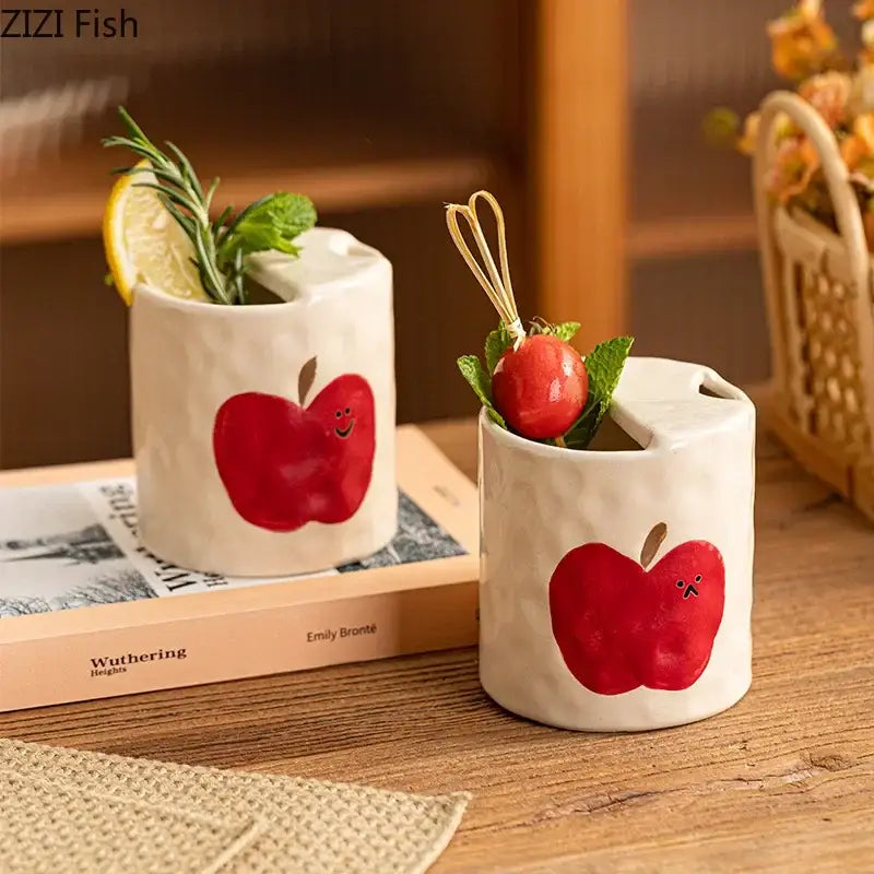 Ceramic coffee mug with textured white glaze and red apple bowknot pattern by decorbites for dining room use