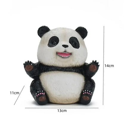 Cute black and white panda baby figurine with pink paws sitting in a cheerful pose for living room decor