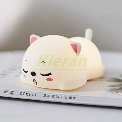 Cream-colored soft silicone cat-shaped night light with pink ears and closed eyes for decorbites cat silicone decorbites cat silicone led night light bedroom decor
