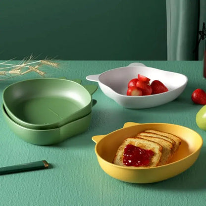 Yellow cat-shaped children’s bowl with glossy plastic finish and rounded ears in cute green bear shape fruit plate set