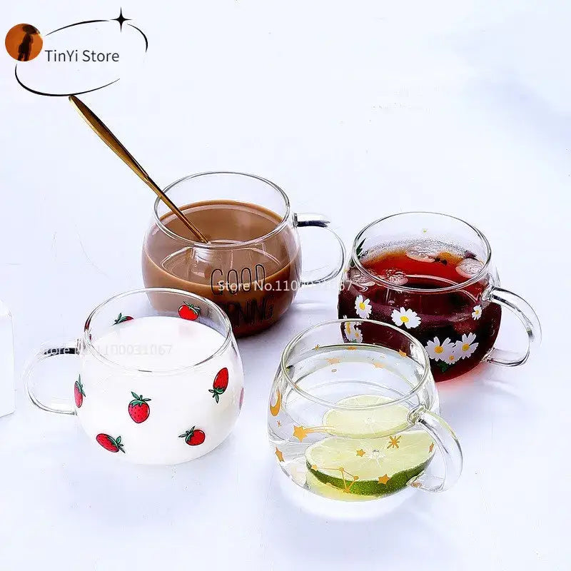 Four clear glass mugs with handles featuring decorbites cute letter designs of fruits and flowers for kitchen use