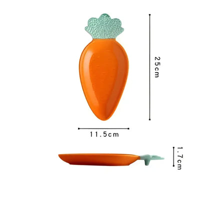 Cute orange and green carrot ceramic tableware set featuring a carrot-shaped dish with a light green leafy top