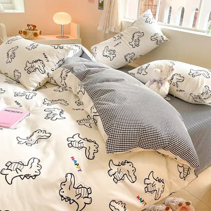White dinosaur-themed bedding set with black line drawings and colorful happy text in decorbites cotton floral print