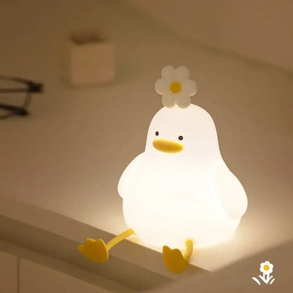 Soft white glowing duck-shaped silicone night light with yellow beak feet and flower decorbites duck cartoon night lamp
