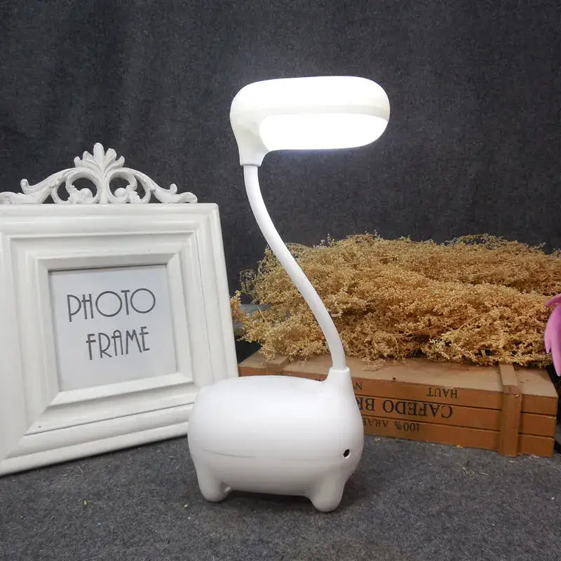 White elephant-shaped led desk lamp with flexible neck and rounded head in decorbites elk night lamp collection