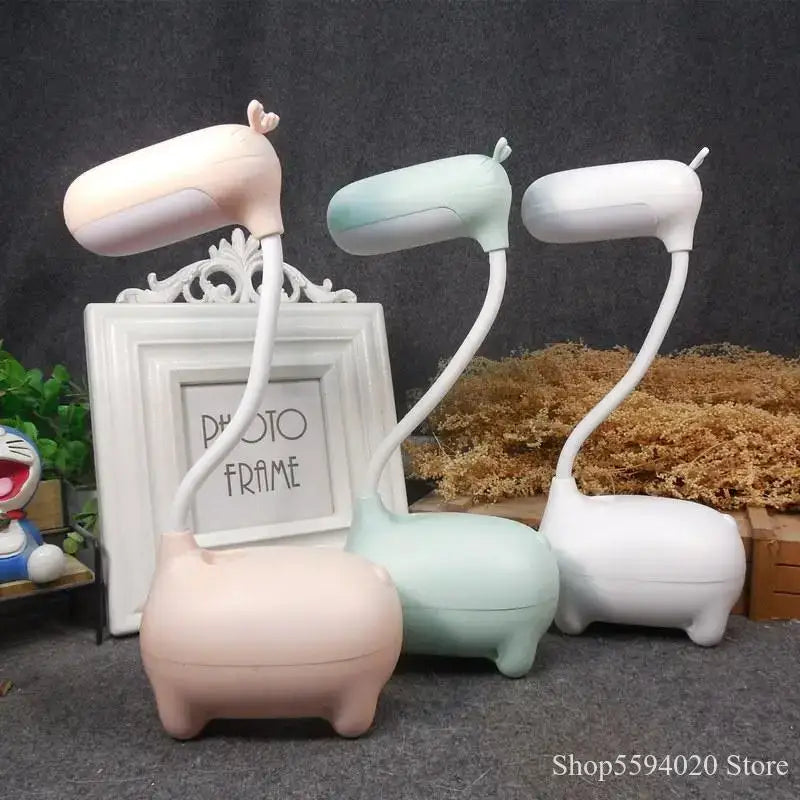 Pastel-colored decorbites elk night lamps shaped like pigs with flexible necks and smooth plastic bodies in pink white and mint