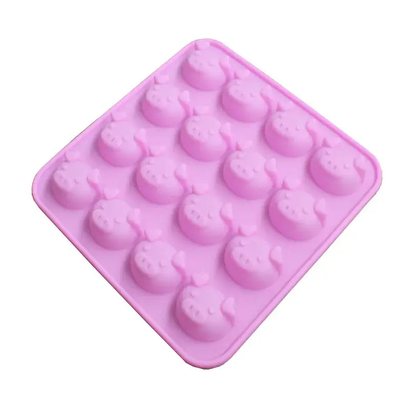 Pink silicone cake mold with 16 cute whale-shaped cavities for ice cubes or baking in cute pig head design