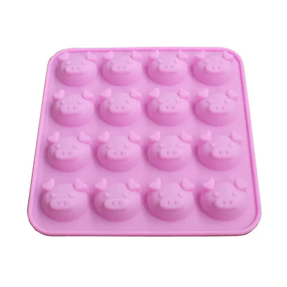 Pink silicone cute pig head cake mold with 16 cavities for baking and ice cubes in the kitchen