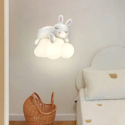 Cute polar bear cloud wall lamp for kids featuring a white bunny-shaped light with closed eyes and pink nose on a soft cloud