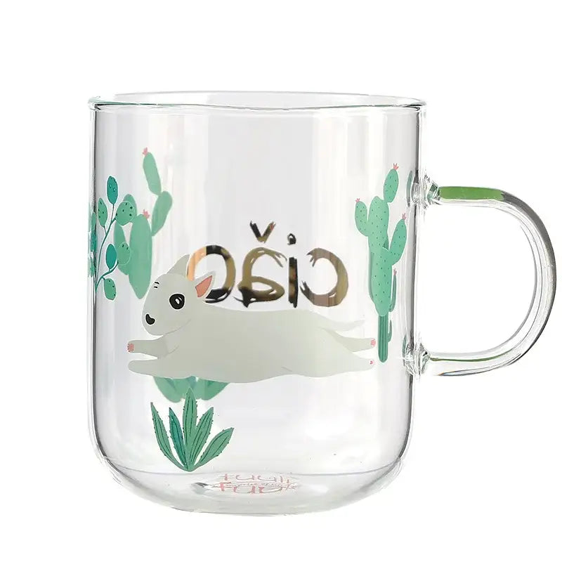 Clear glass coffee mug with white bunny illustration, green cacti, and gold foil cão lettering for tea or coffee use