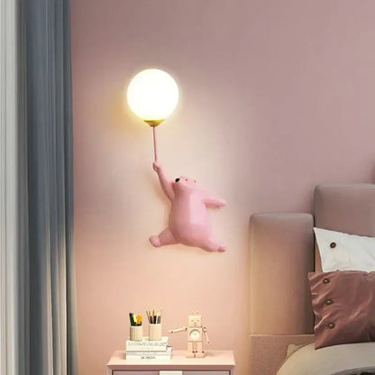 Cute pink bear wall lamp shaped like a polar bear holding a glowing round balloon for bedroom lighting